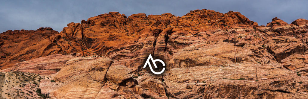 Hero image of Applied Copper logo on rock formation background