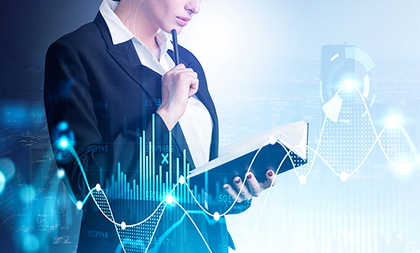 Businesswoman checking notes in notebook. Digital graph of stock market changes.