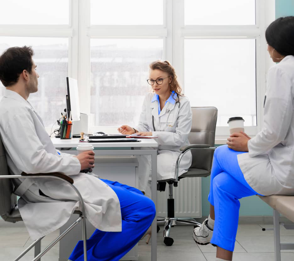 Image of group of doctors at desk.