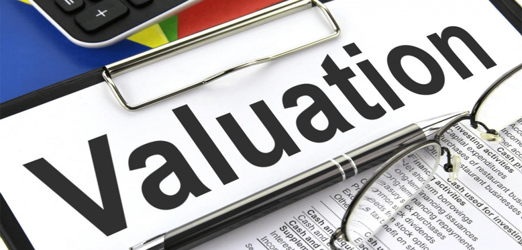 Graphic image of the word "Valuation" on a clipboard with pen and glasses.