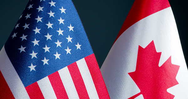 Close up image of national flags USA and Canada.